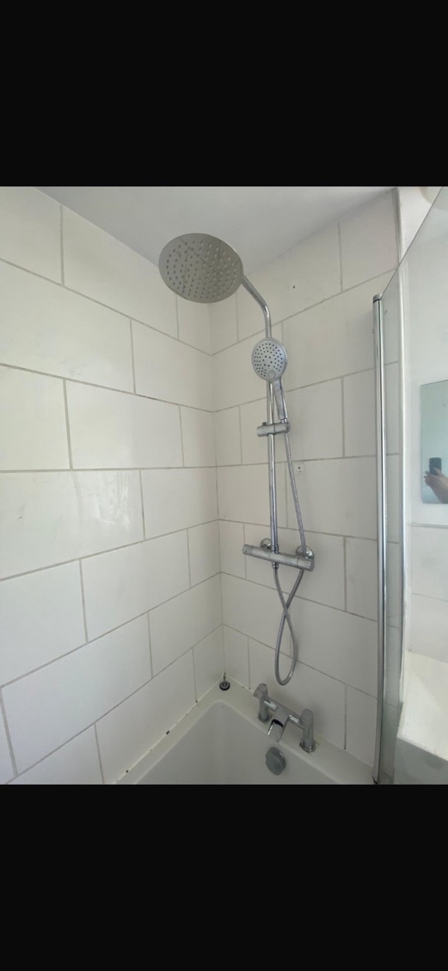 After shower fitting upgrade with large rainfall head and handheld shower installed