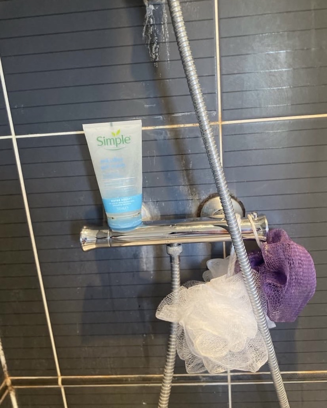 After shower valve replacement with clean chrome shower mixer valve installed